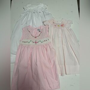 Lot if 3 dresses. Two smocked. Size 24 months, 18 months, 2T in GUC  pink white